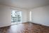 living space with vinyl plank flooring with sliding door out to patio