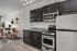 Virtually staged kitchen with stainless steel appliances, espresso cabinets and wood-style flooring