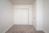 bedroom with carpet and sliding door closet