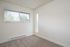 bedroom with carpet and large window