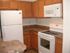 kitchen with white appliances at brooktree apartments