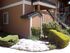 entrance to two story apartment building and landscaping at brooktree apartments