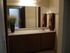 bathroom with large vanity and single sink to the right at plumas garden apartments