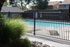 pool with fence and walkway at plumas garden apartments