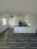 living room, kitchen and dinning area with wood inspired vinyl flooring at the creek at south carson