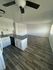 living room, kitchen and dinning area with wood inspired vinyl flooring at the creek at south carson