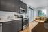 Virtually staged apartment with quartz countertops, stainless steel appliances, and lvp flooring