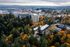 The Fredrick Aerial Exterior photos during fall landscape tucked away in the trees. View of Portland, Oregon skyline
