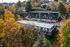 The Fredrick Aerial Exterior photos during fall landscape tucked away in the trees
