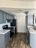 kitchen with stove, fridge, and appliances and vinyl wood like flooring at Monterey Apartments
