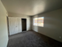 Bedroom with full size closet and window