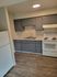 kitchen with stove, fridge, and appliances and vinyl wood like flooring at Monterey Apartments