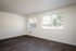 Spacious living room with large windows and Vinyl Wood Like Flooring