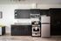 staged kitchen at milano featuring espresso cabinets and stainless steel appliances