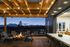 fire pit and rooftop deck at dusk at The Hixon as well as indoor-outdoor space