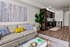Open living area and kitchen with stainless steel appliances and modern fixtures