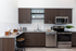 2-Bedroom Apartments in Bend, OR - The Hixon - Kitchen with Stainless Steel Appliances, Granite Countertops, Wood-Style Cabinets, Ceramic Tile Backsplash, Durable Plank Vinyl Tile Flooring, and High Ceilings