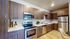 Full kitchen with stainless steel appliances