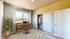 3-Bedroom Apartments In Reno, NV - Canyon's Edge - Spacious Bedroom With Wood-Inspired Flooring, Windows For Natural Light & A Premium View, And A Closet With Sliding Doors