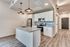 open kitchen with stainless steel appliances and floor to ceiling windows and patio door at oner midtown