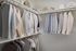 large walk in closet with two levels of racks