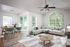 living room with sliding door access to balcony/patio and ceiling fan aat kitchen with wood style plank flooring and stainless steel appliances at van mall north apartments