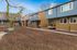 grassy common area with two story apartments in the background at shady glen
