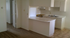 kitchen with a breakfast bar at palace apartments