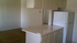 kitchen with a breakfast bar at palace apartments