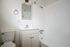 Bathroom with sink toilet and dual shower bathtub