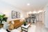 living room with brown leather sofa coffee table and open floor plan