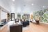 Clubroom with fireplace and sofas for residents