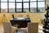 office with desk and decorative accessories and two beige chairs