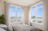 virtually staged bedroom with oversized windows adding to the natural light