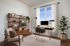 Virtually staged office featuring a large window allowing natural light and luxury vinyl plank flooring
