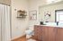 upgraded bathroom with top-of-the-line finishes including quartz countertops and luxury vinyl plank flooring