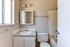 Bathroom with sink, shower, and toilet