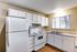 Full kitchen with fridge, oven and sink