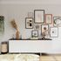 gallery wall with multiple shaped and sized frames