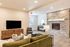 sofa and tv with a fire place nearby at the Clubhouse at Fernhill