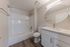 Bathroom with tub, shower, toilet, and sink