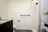 Bathroom with full sized washer dryer