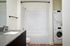Bathroom with full sized washer and dryer