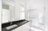 Bathroom with double vanity and walk in shower