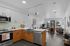 https://teraStaged kitchen with light green backsplash, stainless steel appliances, quartz countertops and dual tone wood and white cabinets and living roomvabend.com/