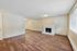 living room with fireplace and faux wood flooring at quad apartments