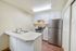 kitchen with faux hardwood flooring and stainless steel appliances at Senior Estates 1