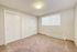 bedroom with large sliding door closets