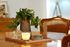 round wooden dinning table with decorative items in the center