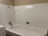 Bathroom with white tile shower and tub